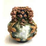 An Art Nouveau baluster vase, Amphora Austria, encrusted with rose blossoms and gilt foliage, some