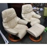 A pair of Ekornes Stressless swivel reclining armchairs, in cream, together with a matching