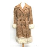 A ladies double breasted lambswool coat, with trimmed cuffs and hem, approx. size 10 (slight tear to