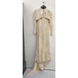 A vintage wedding dress with balero jacket and train, approx size 10