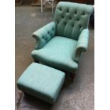 A recently reupholstered 19th century button back low armchair, with scrolling arms and turned front