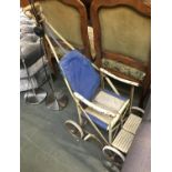 A vintage push along child's pram