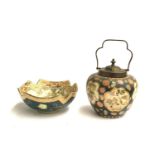 A 20th century Japanese lidded crackle glaze biscuit barrel decorated with panels of flora and