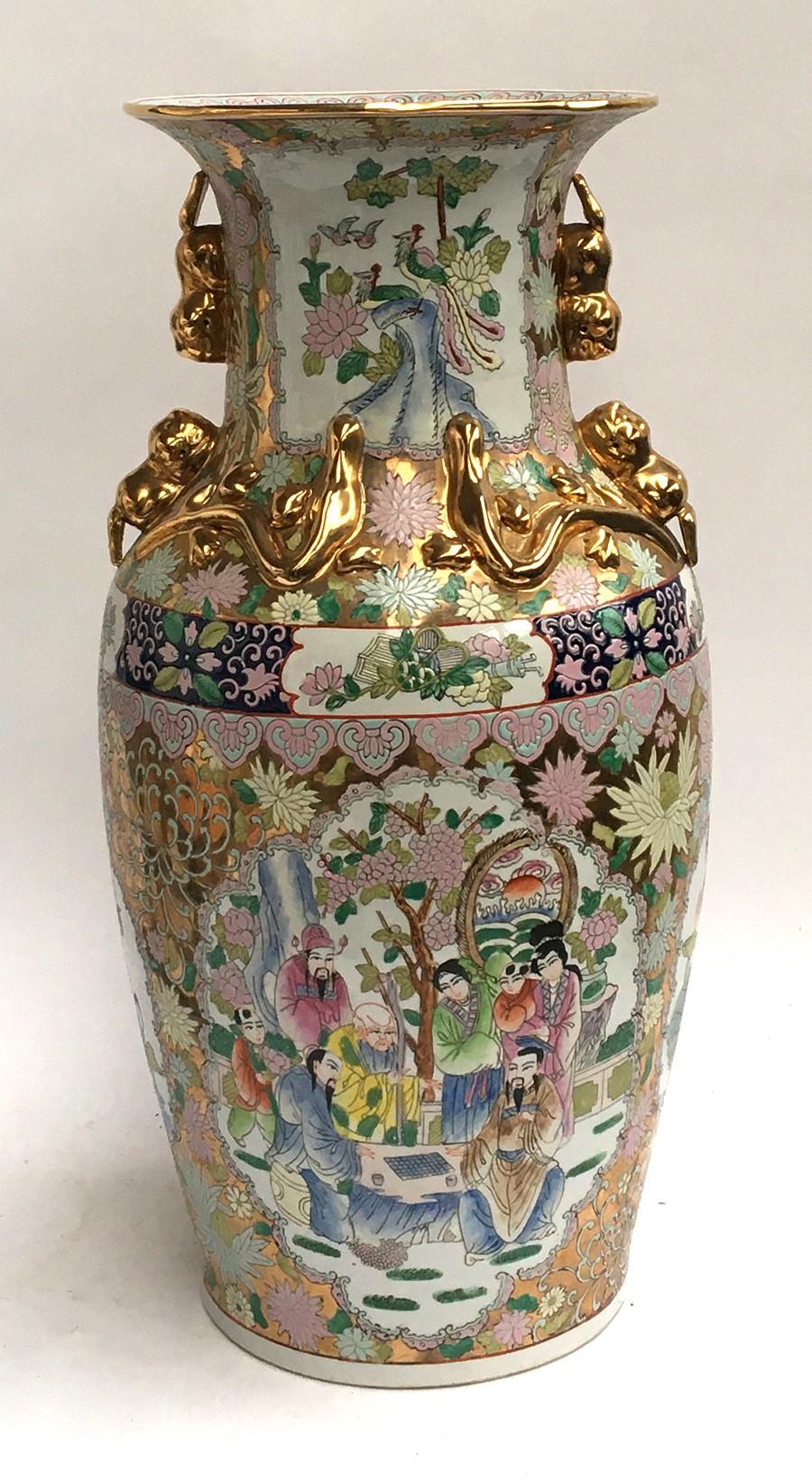 A large 20th century Chinese baluster vase, decorated with panels depicting lotus flowers and