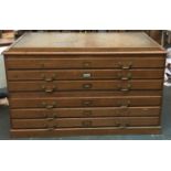 A large oak plan chest, the hinged top with tooled leather skiver, six drawers, 150x90x87cmH