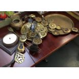 A mixed lot to include a quantity of leather mounted horse brasses, several brass trays, fire tools,