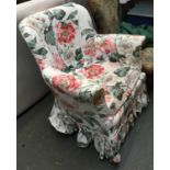 A small armchair on cabriole legs