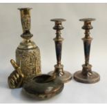 A pair of plated candlesticks, with removable bobeches; together with an Indian bowl, and Eastern