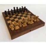 A wooden folding chess board containing complete chess set, with backgammon board within, 38cmW