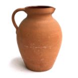 A large terracotta jug, 32cmH
