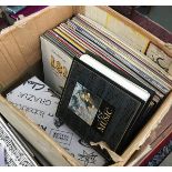 A mixed box of vinyl LPs, mainly classical; together with a number of 7" single of rock and pop from