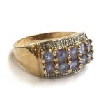 A 9ct gold ring set with purple stones and zircons, 3.8g