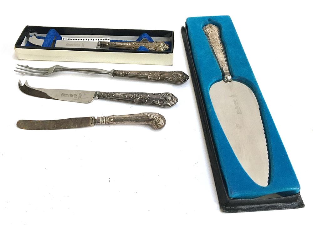 Two King's pattern cheese knives, pickle fork, and cake slice, each with silver handle; together