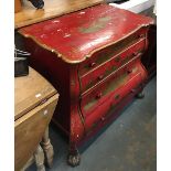 A 19th century red japanned chest of bombe form, with gilt decoration, four drawers on ball and claw