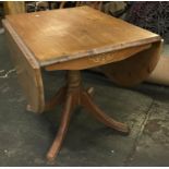 A 20th century pine dropleaf table on column base with swept legs, 92cmW
