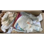 A mixed box of vintage fabric samples, tableware, curtains, etc