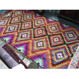 A very large brightly coloured flat weave kilim rug, 295x175cm