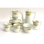 A Noritake coffee set, heightened in gilt, comprising coffee pot, coffee cans and saucers (5),