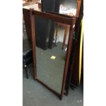 A hardwood framed wall mirror