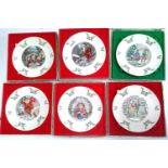 A collection of six boxed Royal Doulton Christmas plates, each 21cmD