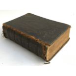 A leather bound Victorian family bible, printed by William Collins Sons & Co., with the commentaries