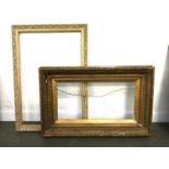 A large giltwood and gesso picture frame, internal dimensions, 32x62cm, together with one other