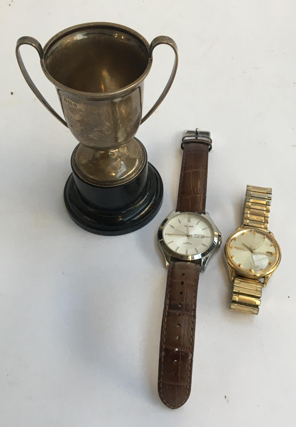 A small silver trophy cup together with a Seiko selfdater 24 j gents wristwatch (winder missing);