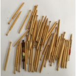 A quantity of wooden lace making bobbins