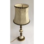 A gilt metal and marble table lamp