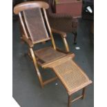 A folding caned campaign style chair