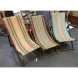 Three vintage deck chairs with striped fabric; together with one other vintage folding chair (4)