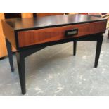 A contemporary black wood side table, quarter veneered single drawer, on square tapered legs,