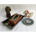 A resin bust of a boy; wooden tissue box; enamel plates; ceramic pot in the form of a goat;