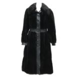 A Maxwell Croft of London black fur coat with leather trim, approx. size 10