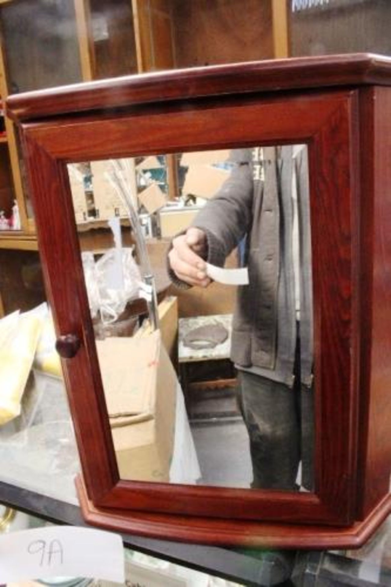 A mahogany finish mirrored door corner cupboard (Cfloor)