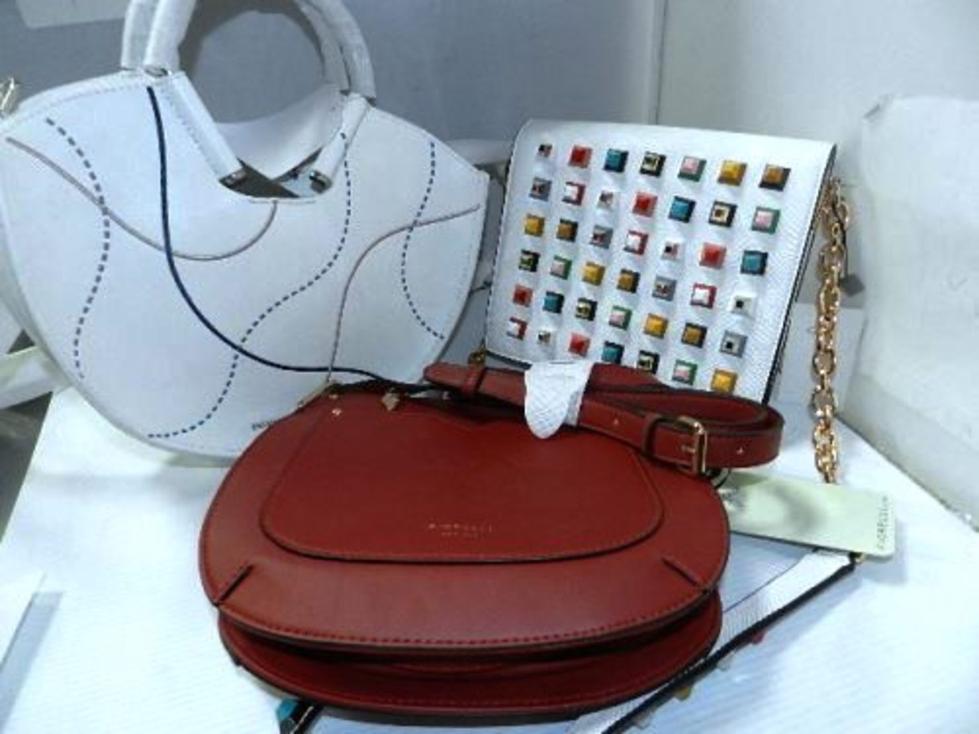 3 x ladies handbags comprising 1 x Charles & Keith U shape, 1 x Dune Pyramid Stud and 1 x Fiorelli