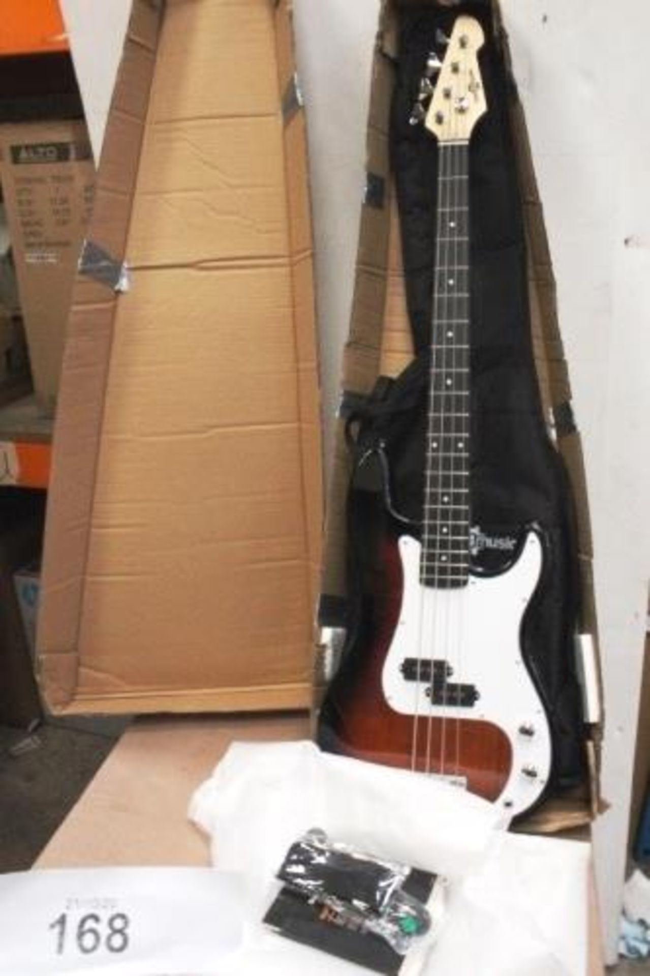 Gear4Music electric bass guitar starter kit includes G4M Squier bass guitar, travel bag, spare