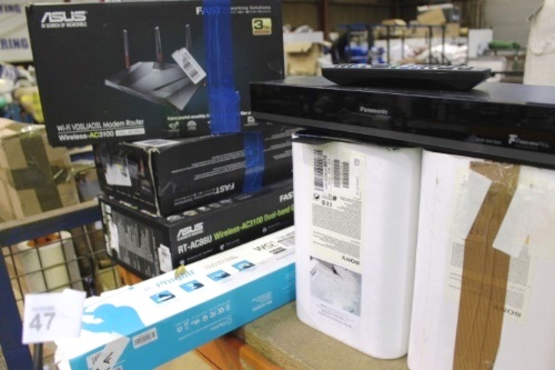 A quantity of assorted electrics including 2 x Asus AC3100 routers, Asus RT Ac88u router etc. -