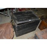A painted storage trunk with metal lined interior