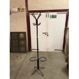 A metal military hat and coat stand