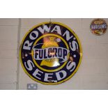 A circular enamel advertising sign for "Rowans Ful