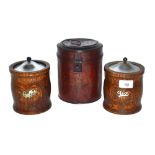 An early 20th Century metal tea canister and two m