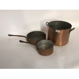 Two copper saucepans and a large copper boiling pa