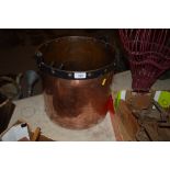 An Antique copper and iron pail with bracket