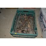 A plastic crate and contents of various door handl