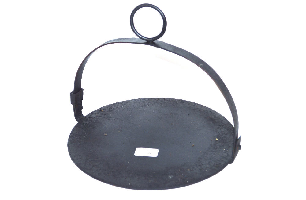 An Antique iron hanging griddle