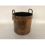 A circular coppered two handled pail, stamped Unit