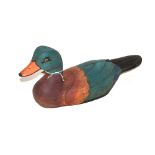 A painted wooden decoy duck