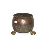 An Antique copper jardiniere with brass feet