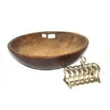 An Antique wooden bowl and a plated toast rack